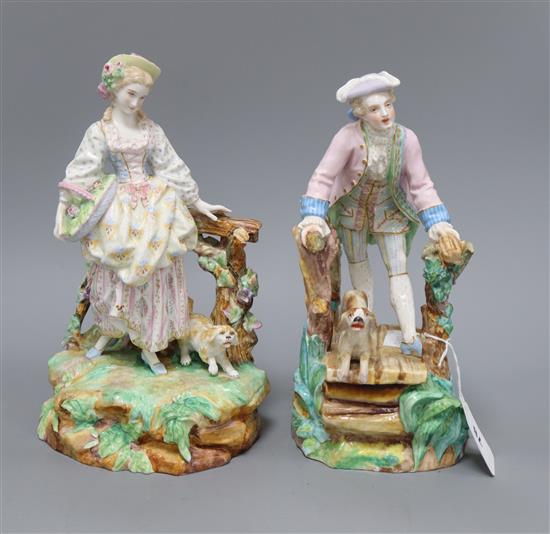 A pair of Paris porcelain figures of a man and his dog on a bridge, and a lady and her dog tallest 28cm